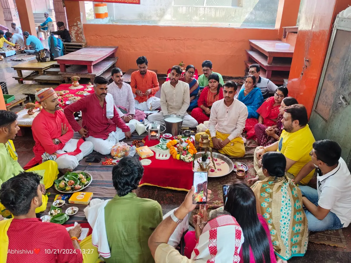 Families seated for puja in the hall of Mangalnath Mandir, Ujjain